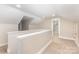 Upstairs hallway featuring a light-colored carpet and neutral paint at 1208 Fordham Rd, Charlotte, NC 28208