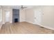 Open-concept living room showcasing new wood flooring, modern fireplace, and neutral paint at 1208 Fordham Rd, Charlotte, NC 28208