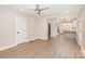 Spacious living room with hardwood floors, neutral walls, and a view into the updated kitchen at 1208 Fordham Rd, Charlotte, NC 28208