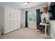 A comfortable bedroom features a ceiling fan, built in closet and ample natural light at 1212 Mason Way, Mount Holly, NC 28120