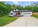 Charming home exterior featuring a red front door, white siding, and a well-manicured lawn at 1212 Mason Way, Mount Holly, NC 28120
