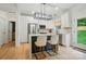 Modern kitchen with white cabinets, stainless steel appliances, and a stylish island at 1212 Mason Way, Mount Holly, NC 28120