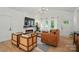 Inviting living room with large windows, a cozy fireplace, and ample natural light at 1212 Mason Way, Mount Holly, NC 28120
