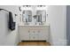 The main bathroom features a double sink vanity with modern fixtures and a stylish mirror at 1212 Mason Way, Mount Holly, NC 28120