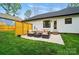 Inviting backyard patio with stylish furniture and a modern privacy screen at 1212 Mason Way, Mount Holly, NC 28120