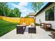 Cozy patio with comfortable seating and a built-in table with a privacy screen at 1212 Mason Way, Mount Holly, NC 28120