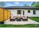 Outdoor patio area with comfortable seating and string lights for ambiance at 1212 Mason Way, Mount Holly, NC 28120