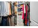 A spacious walk-in closet features custom shelving, hanging rods, and ample storage space at 1212 Mason Way, Mount Holly, NC 28120