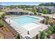 Resort-style community pool with ample lounge seating and well-kept landscaping for relaxation at 13359 Caite Ridge Rd, Davidson, NC 28036