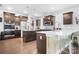 Spacious kitchen featuring white countertops, dark cabinetry, and a functional island at 13359 Caite Ridge Rd, Davidson, NC 28036
