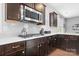 Close-up of modern appliances, countertops, and cabinets in the well-appointed kitchen at 13359 Caite Ridge Rd, Davidson, NC 28036