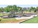 Shot of the community playground equipment with slides, swings, and climbing structures at 13359 Caite Ridge Rd, Davidson, NC 28036