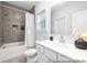 Stylish bathroom featuring a shower-tub combo, tiled walls, and a modern vanity at 1359 Russell St, Rock Hill, SC 29730