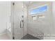 Luxurious bathroom showcasing walk-in shower with rainfall shower head and a tub at 1359 Russell St, Rock Hill, SC 29730