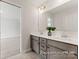 Bathroom featuring double vanity, gray cabinets and a large mirror at 1359 Russell St, Rock Hill, SC 29730