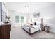 Cozy bedroom featuring a large window, neutral decor, and light-colored walls at 1359 Russell St, Rock Hill, SC 29730