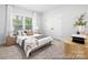 Bedroom with a large window, light-colored walls, and minimalist decor at 1359 Russell St, Rock Hill, SC 29730