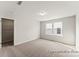 Spacious bedroom with two windows, neutral carpet, and walk-in closet at 1359 Russell St, Rock Hill, SC 29730