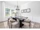 Modern dining room features a statement light fixture and decorative mirrors at 1359 Russell St, Rock Hill, SC 29730