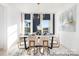 Bright dining area with large windows, modern chandelier, and tastefully decorated dining table at 1359 Russell St, Rock Hill, SC 29730