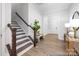 Entryway with wooden staircase, wainscoting, and stylish decor at 1359 Russell St, Rock Hill, SC 29730