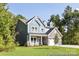 New construction home with stone accents, charming dormers, gray siding and covered porch at 1359 Russell St, Rock Hill, SC 29730