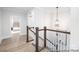 Elegant hallway with hardwood floors, a staircase, and a view into a bedroom at 1359 Russell St, Rock Hill, SC 29730