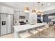 Stylish kitchen with stainless steel refrigerator, gray cabinets, and a large island with seating at 1359 Russell St, Rock Hill, SC 29730