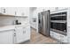 Bright, white kitchen featuring stainless steel appliances and lots of counter space at 1359 Russell St, Rock Hill, SC 29730