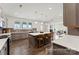 Open concept kitchen with a large island, modern appliances, and hardwood floors throughout at 1359 Russell St, Rock Hill, SC 29730