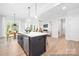 Open kitchen featuring a large island with seating, stainless steel appliances, and lots of light at 1359 Russell St, Rock Hill, SC 29730