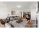 Bright living room featuring modern furnishings, a patterned rug, and open access to the kitchen at 1359 Russell St, Rock Hill, SC 29730