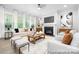 Bright living room with a fireplace, large windows, and neutral furniture at 1359 Russell St, Rock Hill, SC 29730