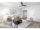 Spacious living room with modern decor, stylish seating, and a decorative ceiling fan at 1359 Russell St, Rock Hill, SC 29730