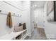 Mudroom with built-in bench, hooks, and access to bathroom at 1359 Russell St, Rock Hill, SC 29730