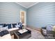 Cozy screened porch with comfortable seating, perfect for relaxing outdoors at 1359 Russell St, Rock Hill, SC 29730