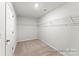 A walk-in closet with wire shelving and carpeted flooring at 1359 Russell St, Rock Hill, SC 29730