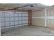 Spacious garage with a metal door features ample room for parking and storage at 1367 Springview Ct, Rock Hill, SC 29732