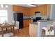 Functional kitchen with ample cabinetry, modern appliances, a breakfast table, and barstool seating at 1367 Springview Ct, Rock Hill, SC 29732