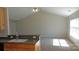 Open living area with plenty of natural light, featuring a kitchen bar, and high ceilings at 1367 Springview Ct, Rock Hill, SC 29732