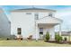 Spacious backyard shows a patio area, outdoor seating, with lush landscaping and a well-maintained lawn at 14015 Penbury Ln # 373, Charlotte, NC 28278