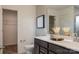 Modern bathroom featuring double sinks, a quartz countertop, and decorative touches at 14015 Penbury Ln # 373, Charlotte, NC 28278