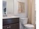 Bathroom featuring a granite countertop, and decorative wall art at 14015 Penbury Ln # 373, Charlotte, NC 28278