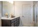 Sleek bathroom with a double vanity, modern fixtures, and a glass-enclosed shower at 14015 Penbury Ln # 373, Charlotte, NC 28278