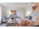 Serene bedroom with a writing desk and a cozy chair at 14015 Penbury Ln # 373, Charlotte, NC 28278