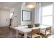Bright dining area with natural light, stylish decor, and a modern white table at 14015 Penbury Ln # 373, Charlotte, NC 28278