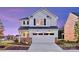 Beautiful two-story home featuring a spacious two-car garage and a well-manicured lawn, inviting curb appeal at 14015 Penbury Ln # 373, Charlotte, NC 28278