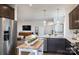 Modern open concept kitchen overlooking the living room, with stainless steel appliances at 14015 Penbury Ln # 373, Charlotte, NC 28278