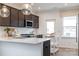 Modern kitchen features stainless steel appliances and a large island counter at 14015 Penbury Ln # 373, Charlotte, NC 28278