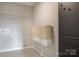 Practical laundry room offers functional storage baskets and a convenient folding area at 14015 Penbury Ln # 373, Charlotte, NC 28278